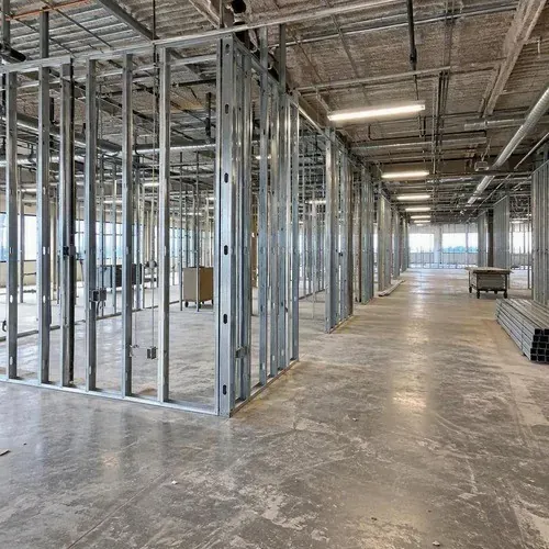 Empty commercial space in Kingston framed with steel studs before drywall