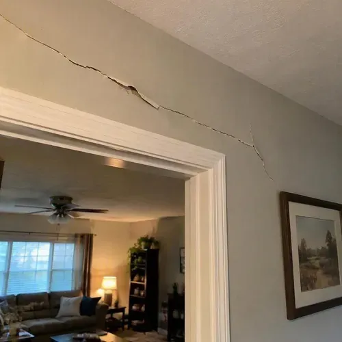 Long crack running above a doorway on a drywall repair job in Kingston, ON