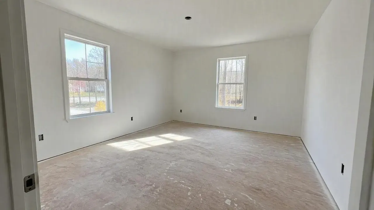 Finished room primed white ready for flooring on a Kingston Drywall project