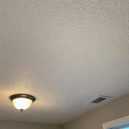 Blended texture repair finished on ceiling during textured ceiling and wall repair in Kingston, ON